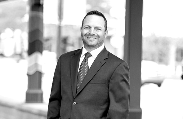 Man standing and smiling
