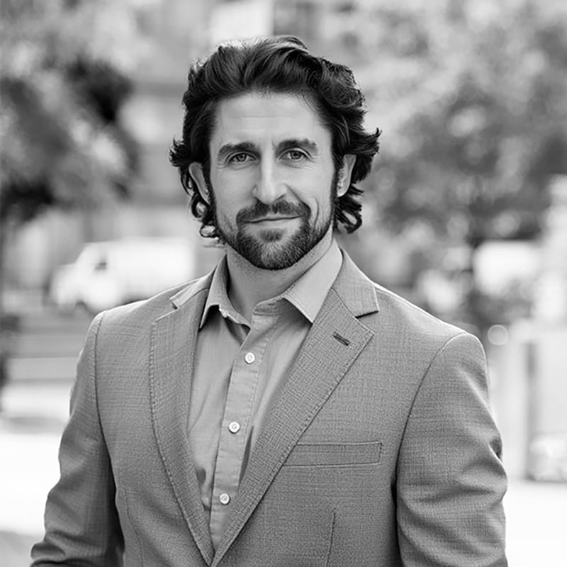 man in suit in black and white